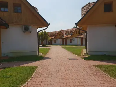 a brick road in a village with houses at TULPIKA 13 in Moravske Toplice