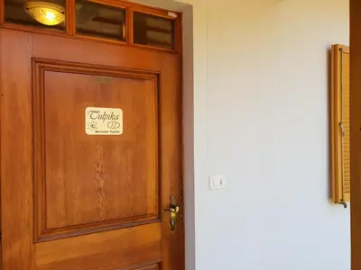 a wooden door with a sign on it at TULPIKA 13 in Moravske Toplice
