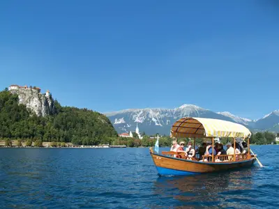 a group of people on a boat on the water at Sky in Bled
