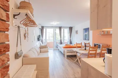 a living room with a couch and a table at Chic Cosy Quiet in Ljubljana Center in Ljubljana