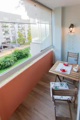 a dining room with a table and a window at Chic Cosy Quiet in Ljubljana Center in Ljubljana