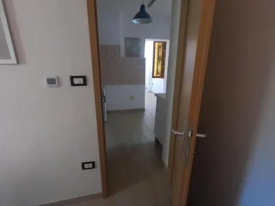 a hallway with a door leading into a room at Fontana in Bovec