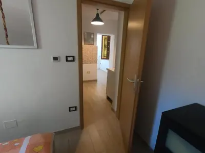 a hallway with a door leading into a room at Fontana in Bovec