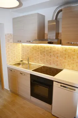 a kitchen with a sink and a stove at Fontana in Bovec