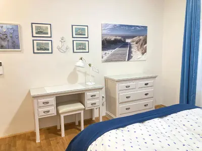 a bedroom with a desk and a bed at Rohrmann apartments in Ljubljana