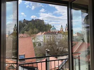 a view from a window of the city of innsbruck at Rohrmann apartments in Ljubljana