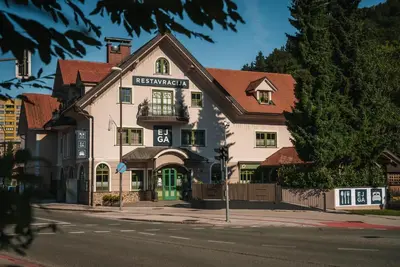 a building on the corner of a street at Guest House EJGA in Jesenice