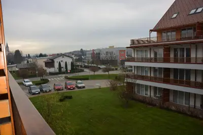 a view of a street with cars parked in a parking lot at Apartment Velcom in Moravske Toplice