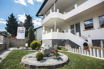 a house with aania sign in front of it at Prenočišče Šinkec Nada in Moravske Toplice