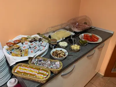 a kitchen counter with a bunch of food on it at Gostisce Sovdat in Bovec