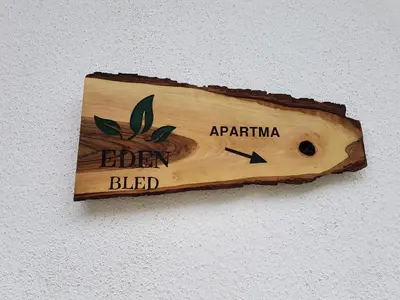 a sign on a wall that says garden bleed at Apartment Eden Bled in Bled