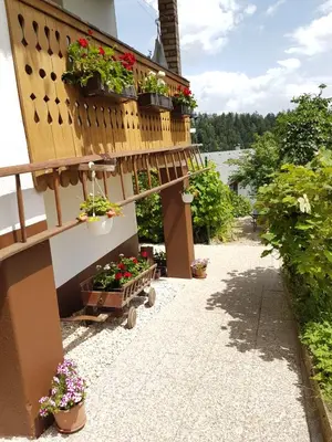 a balcony with potted plants on a building at Apartment Eden Bled in Bled