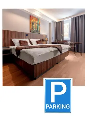 a bedroom with a large bed in a room at Atelier Hotel in Ljubljana