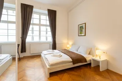 a bedroom with a bed and a window at Urban Rooms--free parking-- in Ljubljana