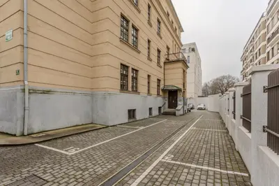 an empty street in front of a building at Urban Rooms--free parking-- in Ljubljana