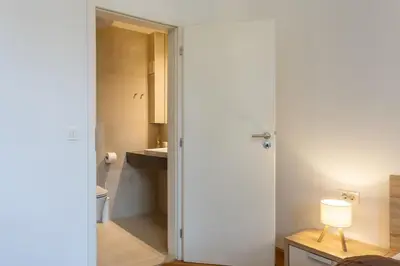a bathroom with a toilet and a sink at Urban Rooms--free parking-- in Ljubljana