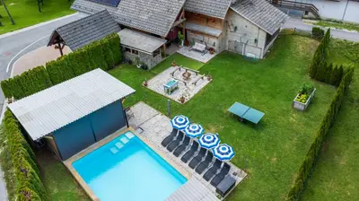 an aerial view of a backyard with a swimming pool at Apartmaji pri Jožu in Bohinj
