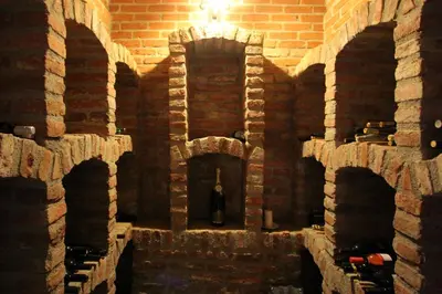 a large brick building with a statue in the middle at Tourism Tompa in Ljutomer