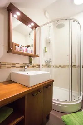 a bathroom with a sink and a shower at Tourism Tompa in Ljutomer