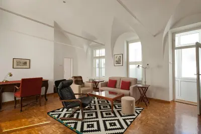 a living room with a couch and chairs and a table at Charming apartment Laura Tour As Ljubljana by Town Hall in Ljubljana