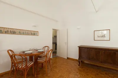 a dining room with a table and chairs at Charming apartment Laura Tour As Ljubljana by Town Hall in Ljubljana