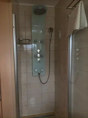 a bathroom with a shower with a shower head at Perfect Apartma - Apartments - Free parking! in Maribor