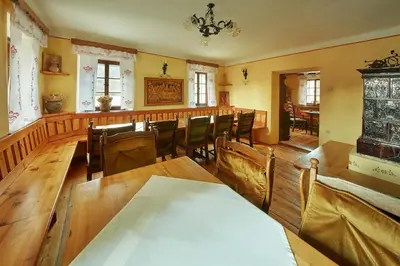 a dining room with a long table and chairs at Rute Hotel and Apartments in Kranjska Gora