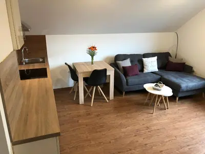 a living room with a couch and a table at Apartments Magdalena in Radovljica