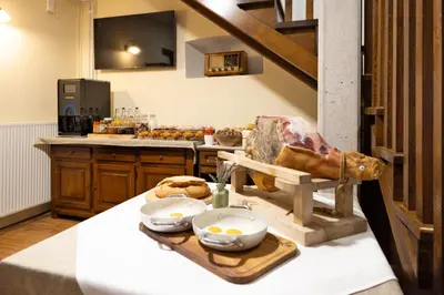a kitchen with a table with some food on it at Kraška hiša Škrla in Divača