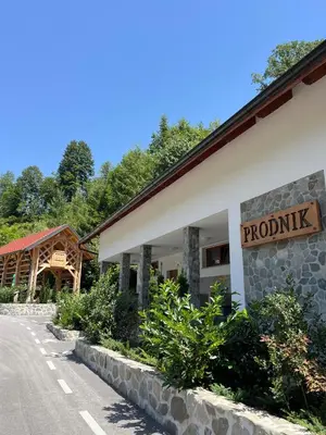a resort with a sign on the side of a road at Šport center Prodnik in Ljubno