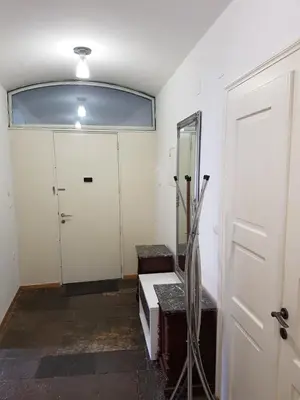 an empty room with a door and a mirror at SIPPO Apartments in Ljubljana