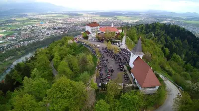 a large group of people standing on top of a mountain at Hotel Bellevue in Kranj