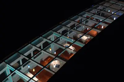 a building with a bunch of glass windows at Hotel Bellevue in Kranj