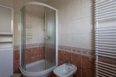 a bathroom with a shower and a sink and a toilet at Vacation Home Sofia in Zgornje Gorje
