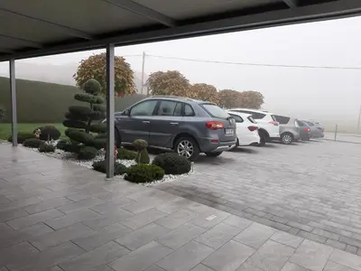 a group of parked cars in a parking lot at Apartmaji Tisa in Moravske Toplice