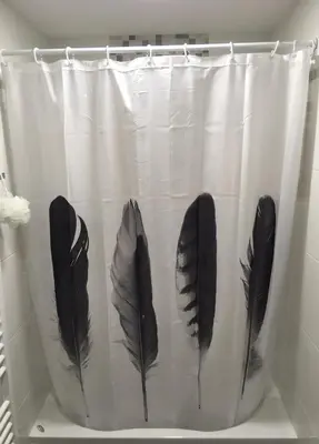 three feathers on a shower curtain in a room at Apartma Gaby in Bled