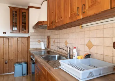 a kitchen with a sink and a counter top at Apartma Gaby in Bled
