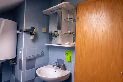 a bathroom with a sink and a mirror at Apartment Stella in Dolenjske Toplice