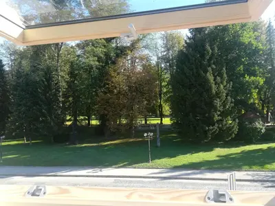 a view of a park from a window at Apartment Stella in Dolenjske Toplice