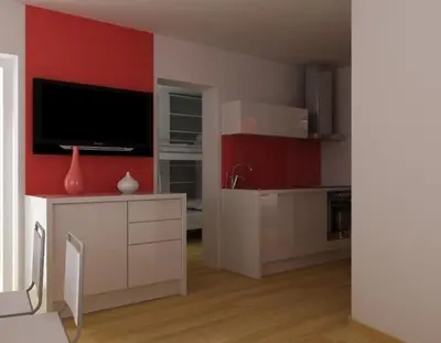 a living room with a kitchen with red walls at Apartments & Wellness Skok in Mozirje