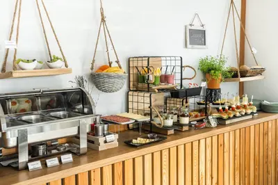 a buffet with food on top of a counter at Apartmaji BANONIA 