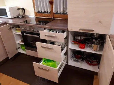 a kitchen with a stove and some drawers at KRESNIČKA in Čatež ob Savi