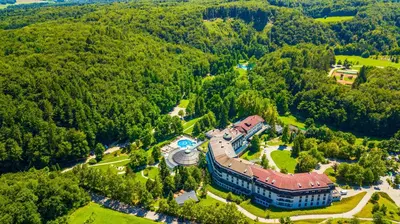 an aerial view of a building in the middle of a forest at Hotel Vitarium Superior - Terme Krka in Smarjeske Toplice