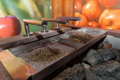 a coffee grinder filled with dirt and pumpkins at Hotel Vitarium Superior - Terme Krka in Smarjeske Toplice