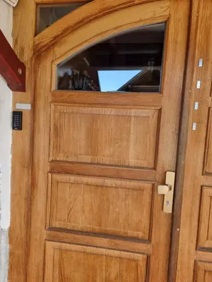 a wooden door with a window on it at Bed and Breakfast Valjavec in Kranj