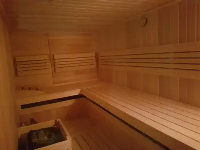 a sauna with wooden bunk beds in a room at Apartments Fazarinc with parking, wellness and city store in the center of Celje in Celje