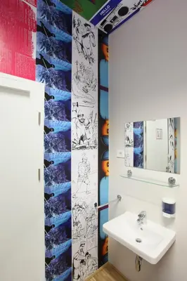 a bathroom with a sink and a mirror at MCC Hostel in Celje