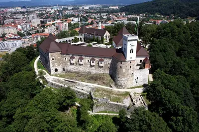 an aerial view of a castle in a city at Chaplin Apartment - Free Garage Parking in Ljubljana