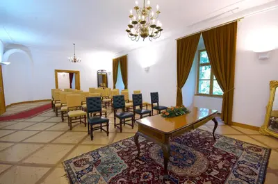 a large room with a table and chairs in it at Grad Goričko in Grad