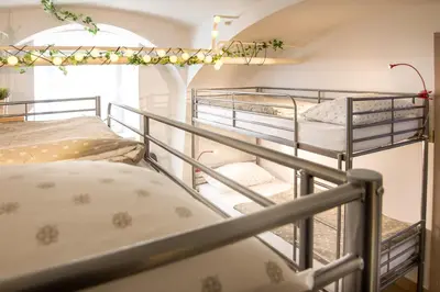 two bunk beds on a staircase in a room at The Maze Apartment in Ljubljana